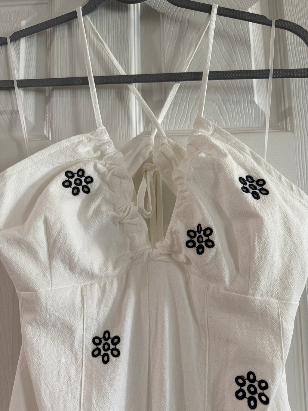 White Spaghetti-Strap Jumpsuit with Black Floral Embroidery