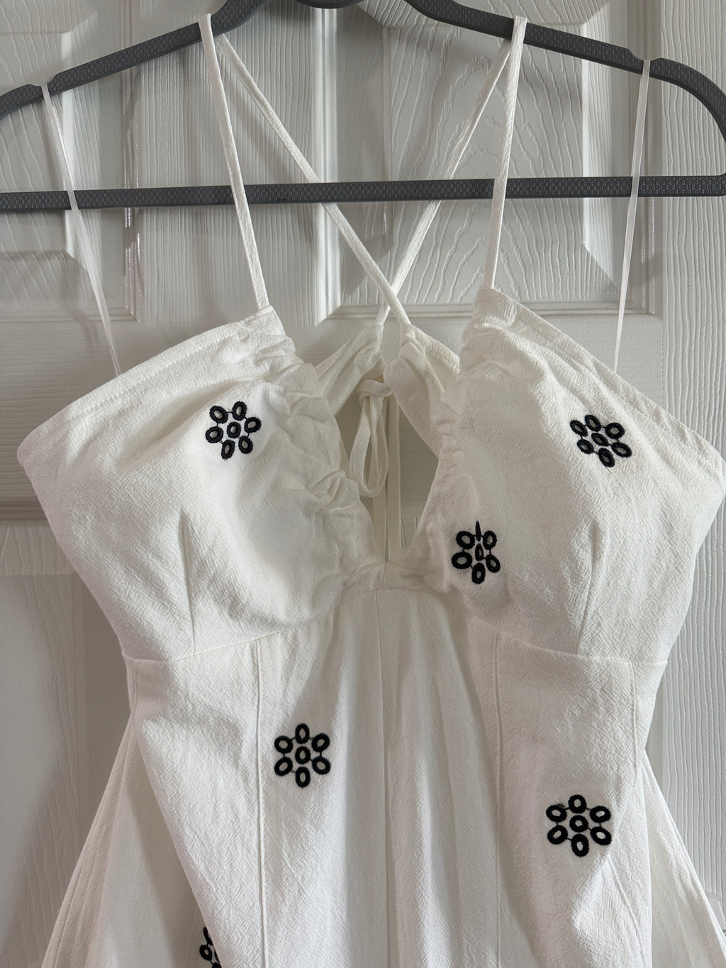 White Spaghetti-Strap Jumpsuit with Black Floral Embroidery