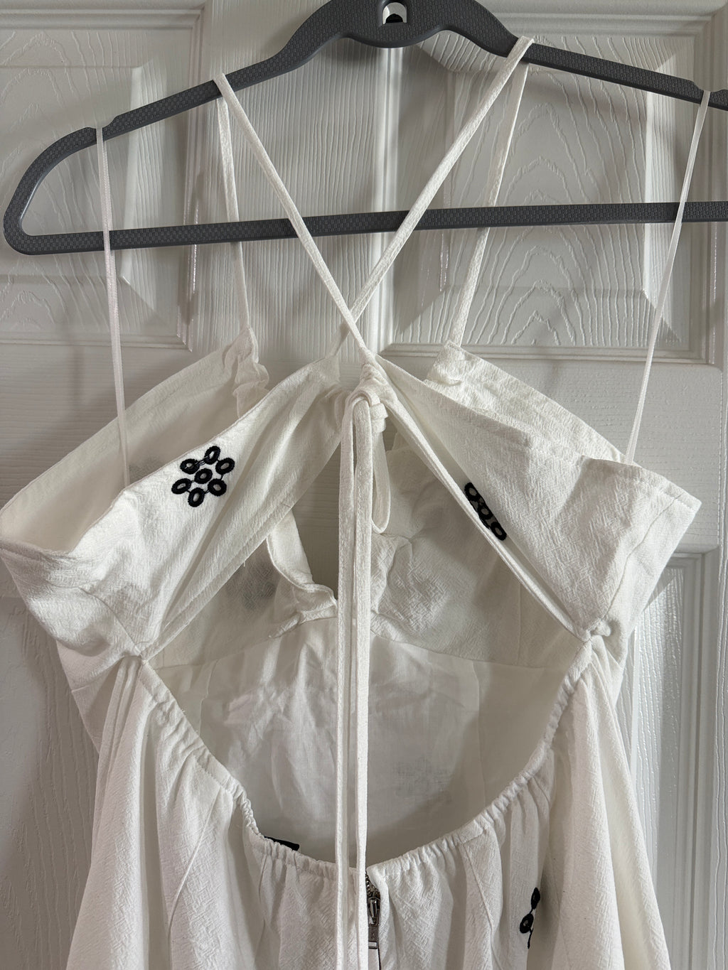 White Spaghetti-Strap Jumpsuit with Black Floral Embroidery
