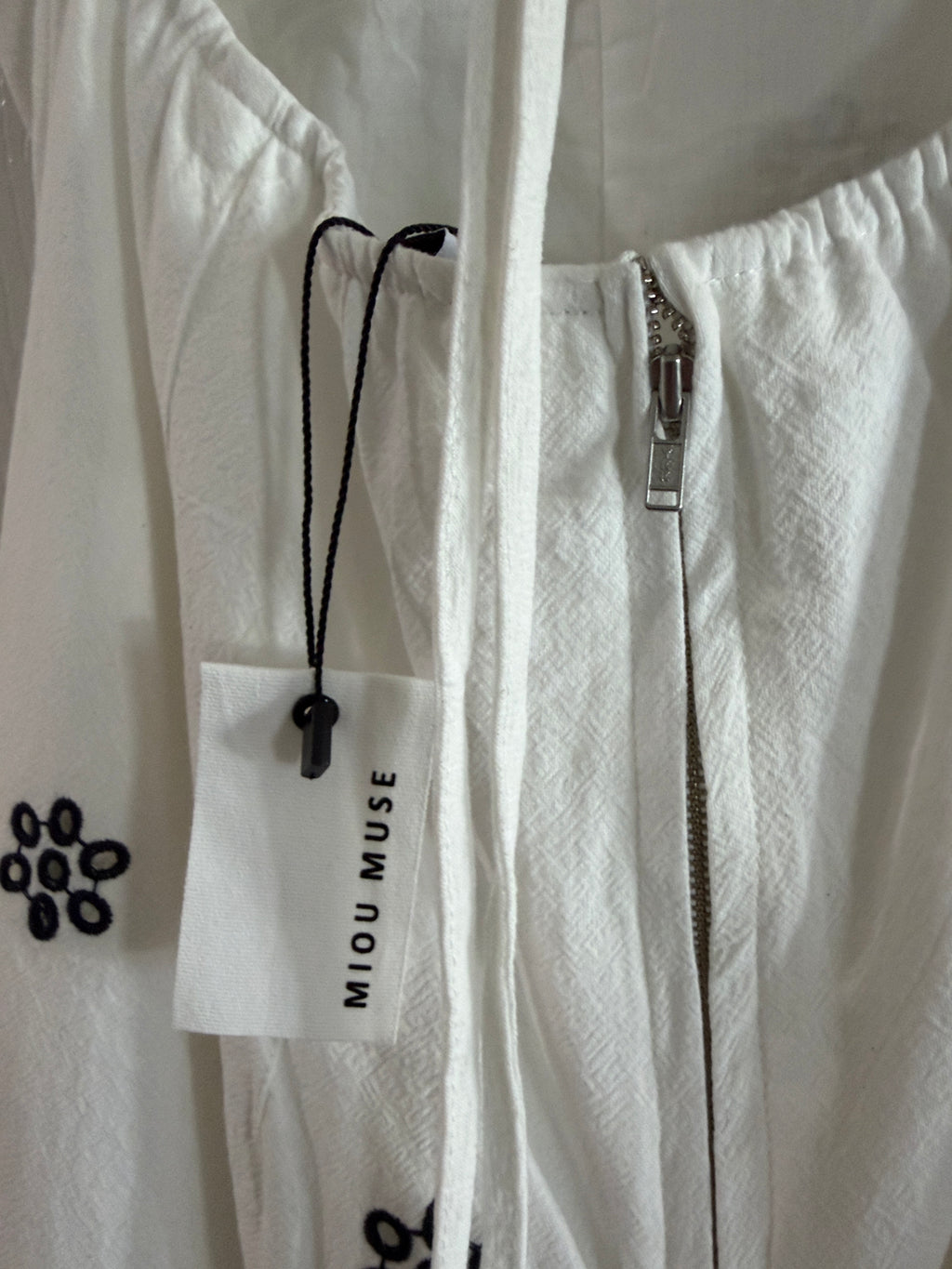 White Spaghetti-Strap Jumpsuit with Black Floral Embroidery